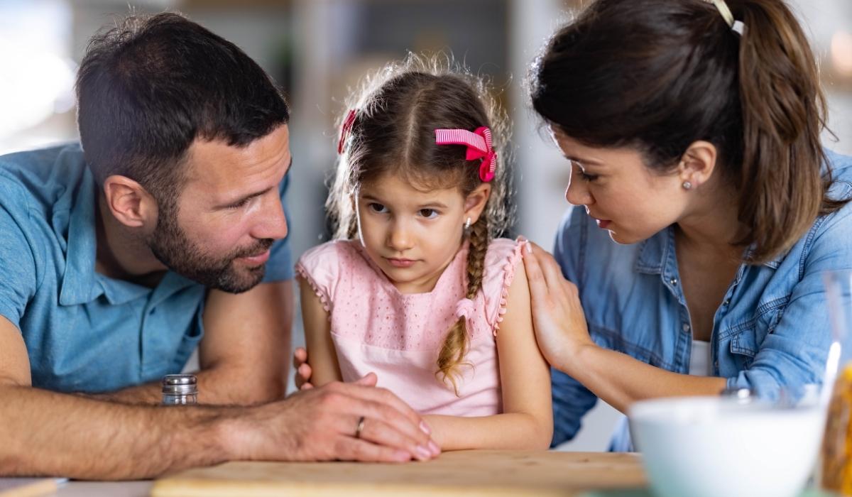 Parent reading with a young child at home